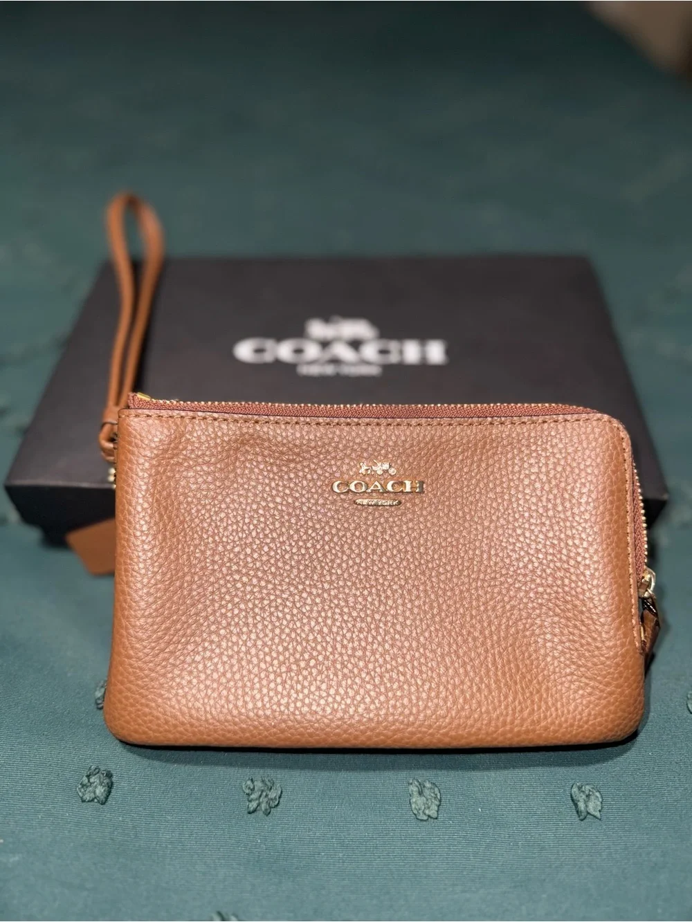 COACH Pebbled Leather Wristlet in Cognac Brown